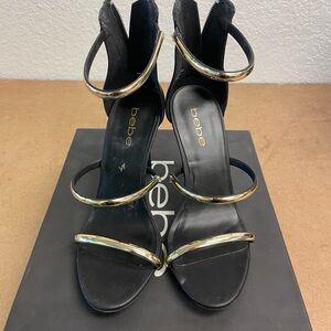 Bebe Elegant Black Heels with Gold Accents